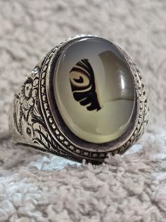 We show you a very old ring Onyx stone with a very clear picture of a fish One of the most requested stones because it is 100% natural. A mixture of colors on a stone of white Yemeni agate, one of the most beautiful stones, handmade The color of the stone is one of the very old rarities, old Iraqi hand work and pure silver For those who do not know what the pictured stones are, they are among the most valuable stones that contain many secrets. Out of every thousand natural agate stones, you will Vintage Silver Crystal Ring With Large Stone, Antique Natural Stones Ring For Gift, Antique Rings With Natural Stones For Gift, Vintage Healing Ring Jewelry, Vintage Rings With Natural Stones For Gift, Vintage Crystal Ring With Natural Stones, Vintage Round Crystal Ring With Natural Stones, Vintage Oval Crystal Ring With Natural Stones, Vintage Agate Jewelry With Large Stone