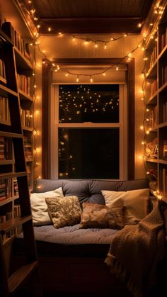 a room with bookshelves and lights on the ceiling, windows are lit up