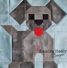 a gray dog with red eyes is on a blue background and has the words sandra healy designs written across it