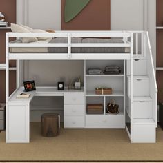 a white bunk bed with desk underneath it