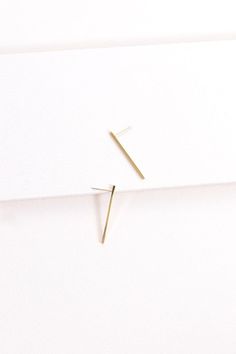 These long and elegant studs hang lightly on the ear lobe and elongate the neck, making them the perfect pairing for a professional outfit or a classy night out.Gold: Stainless Steel, 14k Gold PlatingSilver: Stainless SteelMeasurements: Length: 1.3 in. / 3.3 cm.Care Instructions:Keep jewelry away from prolonged exposure to moisture. Before any activity, take off the jewelry and store it in a dark and dry place. This includes activities such as showering, swimming, or exercising. If the jewelry d Chic Linear Earrings For Formal Occasions, Sleek Formal Drop Earrings, Gold Minimalist Earrings For Evening, Sleek Formal Drop Earrings Jewelry, Minimalist Linear Earrings For Formal Occasions, Sleek Drop Earrings For Formal Occasions, Minimalist Yellow Gold Linear Earrings For Party, Elegant Yellow Gold Threader Earrings For Party, Gold Threader Earrings For Formal Occasions