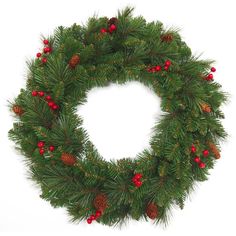 a christmas wreath with red berries and pine cones