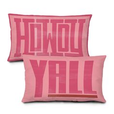 two pink pillows with the words hollywood y'all printed on them, both in red and