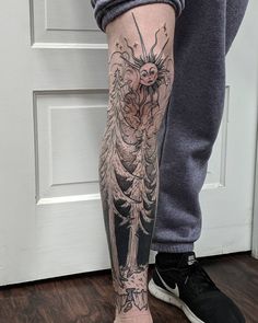 a person with a tattoo on their leg