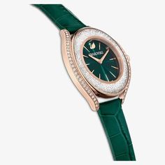 Exude sophistication with the exquisite Crystalline Aura timepiece, crafted in Switzerland. Merging style with utility, it boasts over 1,300 crystals that enhance its rose gold-tone allure, coupled with a water resistance of up to 50 meters. Its lively green dial, marked with the Swarovski swan at 12 o'clock, harmonizes perfectly with the Italian calf-skin leather strap. Green Dial Watch, Swarovski Swan, Oasis Fashion, Pierced Jewelry, Fade Color, Co Ord Set, Sunglasses Sale, Metal Bracelets, Fashion Face