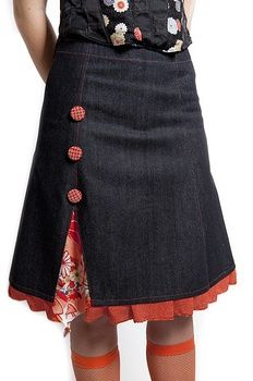 a woman wearing a skirt with buttons on it