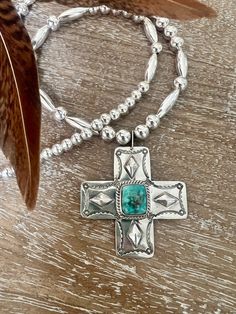 Stunning turquoise Navajo cross signed by Will Denetdale.  The beaded chain is approximately 23 1/2" long.  The cross is 2"x2".  Happy to answer any questions Bohemian Turquoise Cross Pendant Necklace, Handmade Southwestern Style Cross Pendant Jewelry, Handmade Southwestern Cross Pendant Jewelry, Bohemian Beaded Cross Pendant Jewelry, Southwestern Handmade Cross Necklace, Handmade Southwestern Cross Necklace, Turquoise Cross, Navajo Turquoise, Cross Jewelry