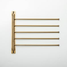 four brass - plated rods on a white background