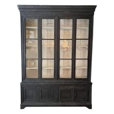 an old black china cabinet with glass doors