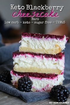 keto blackberry cheesecake bars stacked on top of each other