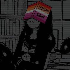 a woman sitting in front of a bookshelf with a book on her head