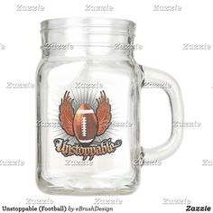 a glass mason jar with an image of a football and wings on the front, inside it