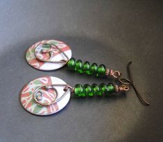 A different twist to your usual holiday earrings featuring green and reddish coral enamel charms. The abstract pattern on the enamels reminds me of a tree branch. I have paired them with spiraling green lampwork beads and copper beads. I have accented them with teardrop shaped copper components. These unique earrings measure 2 1/2 inches in total length and hang on niobium earring hooks. All pieces come boxed ready for gift giving or keeping for yourself. Return to shop: bstrung.etsy.com More li Green Spiral Earrings As Gift, Blue And White Earrings, Lampwork Bead Earrings, Bohemian Christmas, Lampwork Earring, Polymer Earrings, Green Polka Dot, Holiday Earring, Halloween Earrings