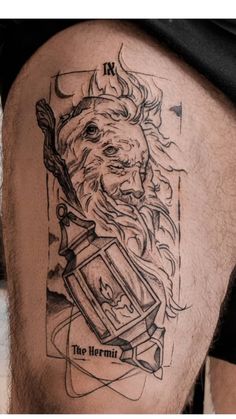 a man's thigh with a tattoo on it that has a drawing of a lion