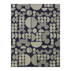 an area rug with circles and dots on the side, in grey and white colors