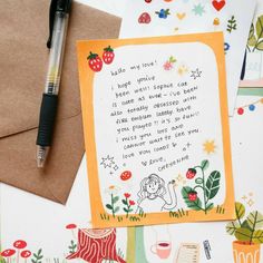 an envelope with a handwritten poem on it next to a pen and some cards