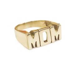 a gold ring with the word mom written in large letters on it's sides