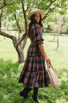 A tried and true Ivy City favorite - The Madeline Dress is BACK in a gorgeous navy plaid! Flowy, feminine, and functional. This festive midi-length dress features a smocked bodice, puff sleeves and ruffle details. And let's not forget this style is both maternity friendly and nursing friendly! Perfect for family matching, family photo season, fall weddings and more! City Woman, Fall Weddings, Fall Plaid, Nursing Friendly, Tea Length Dresses, Tried And True, Midi Length Dress, Tea Length, Fall Collections