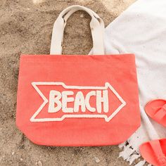 You'll be beach ready with the Aruba Water Resistant Tote! Water resistant so your belongings won't get wet, this tote bag features a vibrant coral color with the word 'Beach' hand embroidered across the front and inner pockets inside for extra organization, this water resistant bag will be your new summertime staple. This beach bag effortlessly doubles as a cruise bag, sports bag, or overnight bag to store your travel essentials. The perfect vacation bag or "weekend vibes'' bag! This reusable t Sand Colored Tote Beach Bag, Summer Orange Beach Bag For Vacation, Orange Summer Beach Bag For Vacation, Casual Orange Beach Bag For Beach Season, Embroidered Beach Bag For Everyday Summer Use, Orange Beach Bag For Summer Vacation, Large Capacity Beach Bag For Weekend, Orange Tote Beach Bag For Vacation, Weekend Tote Beach Bag For Beach Season