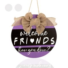 a sign that says welcome friends know you can? with a bow on the front