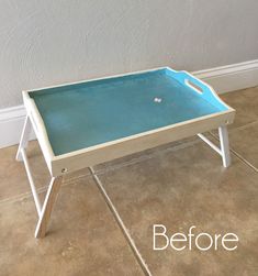 a blue tray sitting on top of a tiled floor next to a white wall with the words before and after written across it