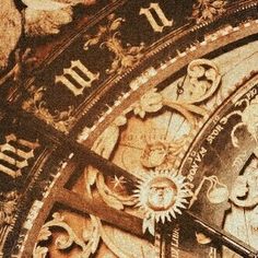 an ornate clock with roman numerals on it