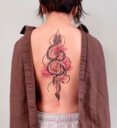 a woman with a tattoo on her back