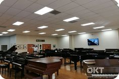 an empty room with piano and other musical instruments