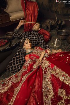 Premium Designer Red Bridal Lehenga Wedding Wear has Heavily Embellished Red Bridal Lehenga in Front Open Gown style paired with Net Embellished Dupatta. Same Black Sherwani for Groom can be separately customizable. Gown: Setting our brides up to ravish in ethereal beauty in this breathtaking ivory angrakha with a flowing organic jaal, made in pure atlas base and sleeves in Sandy hues. With the finest of craftsmanship, this angrakha comes with highly intricate cutwork, further embellished with a Net Dupatta Designs, Nameera By Farooq, Bridal Lehenga Wedding, Red Bridal Lehenga, Maroon Lehenga, Punjabi Suits Party Wear, Pakistani Lehenga, White Lehenga, Asian Wedding Dress