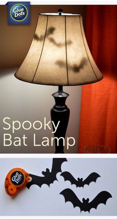 a lamp that is on top of a table next to a bat cutout and the words spooky bat lamp