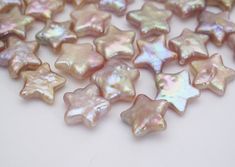 some pink and white stars on a table