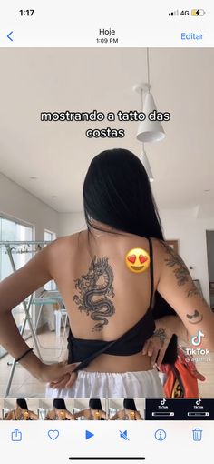 the back of a woman's body with tattoos and emoticions on it