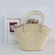 Introducing our Straw Woven Bag for women. Made from high-quality straw, this handbag is perfect for a day at the beach or a casual outing. With a beautiful woven design, this bag is both stylish and functional. Stay on-trend and organized with our Straw Woven Bag. This straw woven bag is the perfect accessory for any beach day or sunny outing. With its lightweight and durable design, it offers both style and functionality. The hand-woven straw material provides a unique and trendy look while also being eco-friendly. Stay fashion-forward and eco-conscious with this beach basket bag. Luxury Trendy Straw Bag For Everyday, Luxury Chic Beige Beach Bag, Luxury Bucket Shape Straw Bag For Beach, Cheap White Straw Bag For Spring, Luxury Trendy Everyday Straw Bag, Luxury Trendy Straw Bag For Shopping, Luxury Beige Chic Beach Bag, Luxury Eco-friendly Bucket Straw Bag, Luxury Straw Bag With Braided Handles For Beach