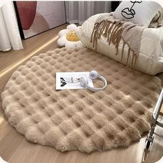 an inflatable bed is on the floor next to a teddy bear and pillows