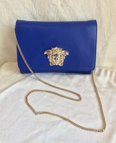 Luxury Blue Bags With Chain Detail, Luxury Blue Bag With Chain Detail, Luxury Blue Bags With Chain, Elegant Blue Bag With Chain Detail, Luxury Blue Chain Bags, Formal Blue Bag With Chain, Blue Evening Bag With Chain Detail, Formal Blue Shoulder Bag With Chain Strap, Formal Blue Bag With Chain Strap