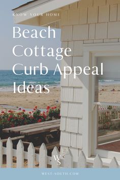 the beach cottage has an open window and white picket fence with red flowers on it