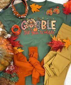 Introducing our "Gobble Til You Wobble Graphic Shirt," a festive and fun addition to your Thanksgiving wardrobe. This shirt features a colorful "Gobble Til You Wobble" design, and it's available in your choice of sand or military green. You can also choose between short sleeve, long sleeve, or sweatshirt options, allowing you to tailor your Thanksgiving look to your preference.
The "Gobble Til You Wobble Graphic Shirt" is perfect for celebrating Thanksgiving with style and humor. Whether you're Gobble Til You Wobble, Thanksgiving Sweatshirt, Thanksgiving Shirts, Holidays Thanksgiving, Graphic Shirt, Military Green, Graphic Shirts, Holiday Season, First Love