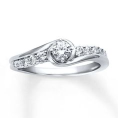 a white gold ring with diamonds on it