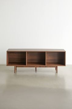 the sideboard is made out of wood and has three compartments on each side, one with