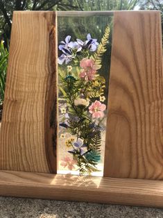 two wooden blocks with flowers in them