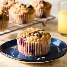 muffins with blueberries and oatmeal are sitting on a plate