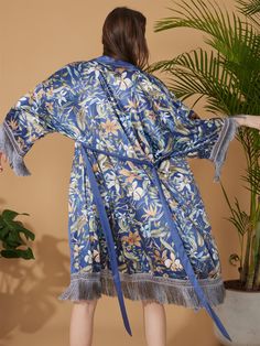 Crafted with meticulous attention to detail, our kimono robe embodies the essence of Eastern luxury, offering you a truly indulgent experience every time you slip it on. Its versatile design effortlessly transitions from leisurely mornings to elegant evenings, ensuring you stay elegant and refined throughout the day. • Silky Comfort: Made of high-quality polyester charmeuse, our robes are soft, lightweight and cooling for summer. They have a smooth and breathable texture that feels just like nat Elegant Kimono Sleeve Robe For Vacation, Elegant Vacation Robe With Kimono Sleeves, Elegant Robe With Kimono Sleeves For Vacation, Elegant Silk Beach Robe, Elegant Silk Robe For The Beach, Elegant Floral Print Beach Kimono, Elegant Beach Kimono With Floral Print, Silk Dressing Gown, Kimono Floral