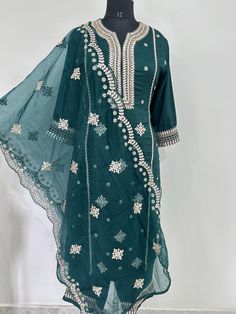 Salwar Kameez Set/Dresses For Women/Indian Wedding Dress/Pakistani Suit/ Kurta Palazzo Set / Kurtis for Women/ Silk Kurta Set Product Details Green Embroidered Kurta with Trousers with dupatta Kurta design: * Embroidered . Straight shape * Regular style *Round neck, three-quarter regular sleeves *l pocket zari detail * Calf length with straight hem * Chanderi silk machine weave fabric Trousers design: * Solid Trousers Partially elasticated waistband *Slip-on closure Material & Care Kurta Fabric: Silk Blend  Trouser Fabric: Silk Blend Dupatta Fabric: Organza Hand Wash items includes One piece Kurta One piece Dupatta One piece Trouser Note:- Please see the size chart in the image to choose a perfect size. Please feel free to ask any questions regarding this item WE ALSO ACCEPT CUSTOMISATION Festive Long Sleeve Unstitched Suit With Gota Work, Wedding Kurta With Gota Work In Mulmul, Green Anarkali Set With Dori Work And Long Sleeves, Wedding Mulmul Kurta With Gota Work, Green Long Sleeve Salwar Kameez With Gota Work, Wedding Churidar With Gota Work In Mulmul, Wedding Mulmul Churidar With Gota Work, Festive Long Sleeve Dresses With Gota Work, Long Sleeve Georgette Kurta With Dori Work