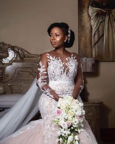 a woman in a wedding dress holding a bouquet