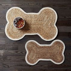 two placemats on a wooden floor with a bowl of dog food in it