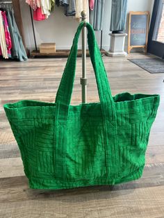 This extra large green tote bag is a spacious and stylish accessory that exudes fun and relaxation. The vibrant green color will add a pop of color to any outfit. Withe textured cloth, this piece will guarantee visual interest to any look. This tote is designed to be practical and functional, with ample room for all your essentials. Trendy Green Hobo Bag For Travel, Trendy Green Tote Shoulder Bag, Green Canvas Tote Bag For Everyday, Green Everyday Canvas Tote Bag, Trendy Green Hobo Bag For Beach, Green Everyday Tote Canvas Bag, Trendy Green Hobo Bag, Casual Green Hobo Shoulder Bag, Green Large Capacity Hobo Bag For Beach