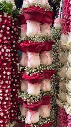 flowers are arranged on display for sale at a flower shop