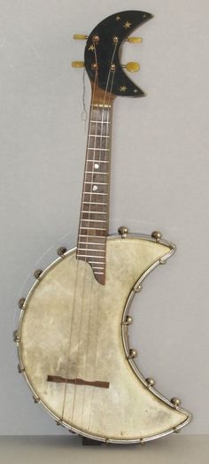 an old guitar shaped like the moon