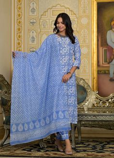 Grab this beautiful 3-piece set. The set comes with printed & embroidered kurta has round neck; 3/4th sleeves & calf length teamed with matching trouser pant and a chanderi cotton dupatta. Color - Blue Kurta Fabric-Viscose Pant Fabric-Viscose Dupatta Fabric - Chanderi Cotton Neck-Round Neck Sleeves-3/4th Sleeves Work - Print & Embroidery Detailing Washing Instructions-Dry Clean Model Height - 5.5 wearing size small. DISCLAIMER - The color of the product may be differ due to screen settings of device. A misprint here and a color drop slip there is the beauty of printing which is not treated as a defect. Spring Blue Chanderi Sets, Traditional Chanderi Pant Set With Long Sleeves, Traditional Pant Set With Dupatta And Long Sleeves, Traditional Long Sleeve Pant Set With Dupatta, Unstitched Cotton Pant Set For Eid, Block Print Long Sleeve Sets For Diwali, Long Sleeve Block Print Sets For Diwali, Long Sleeve Sets With Printed Motifs For Festivals, Eid Cotton Pant Set With Chikankari Embroidery