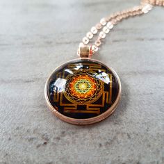 "Sri Yantra sacred geometry necklace . The Sri Yantra, also known as Shree Yantra or Sri Chakra is one of the most powerful and important Yantras to help you fulfill your dreams. It is considered as the mother of all Yantras because they all come from this diagram. Creates material abundance in your life. Sri Yantra has an extraordinary power to fulfill all your wishes and change your life forever. The Sri Yantra benefits and powers should help us to fulfill our desires and make our lives better